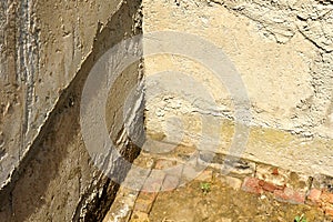 Basement. dirty raw wall. start of construction, foundation