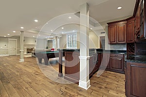 Basement with fireplace and bar