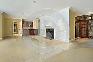 Basement with fireplace and bar