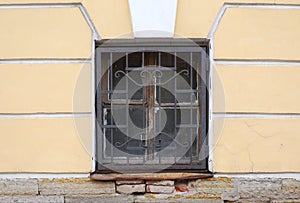 Basement window with a metal barrier