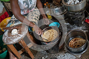 Basic African kitchen. Cooking on the fire Chapati - local food