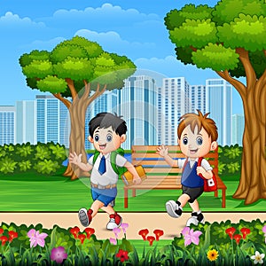 Two boys go to school through the park road
