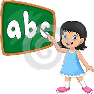 A girl stands in front of the blackboard with a pointer