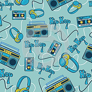 Blue hiphop seamless pattern with recorders, cassettes, headphones and cables. Repetitive background with hip hop underground photo