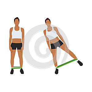 Woman doing Booty or glutes workout with resistance bands. photo