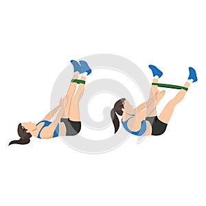 Woman doing Band leg abduction crunch exercise. photo