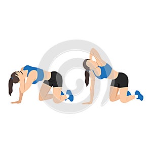 Woman doing exercise in thoracic rotation pose or quadruped rotation photo