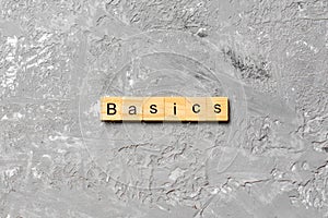 BASICS word written on wood block. BASICS text on table, concept