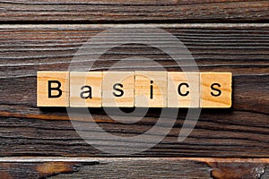 BASICS word written on wood block. BASICS text on table, concept