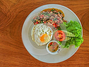 Basil fried rice with minced pork and fried egg a top view of healthy single dish fast food