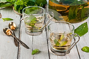 Basil herbal tea on wooden table