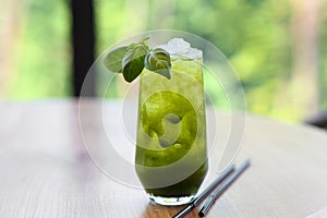 Basil lemonade with ice cubes