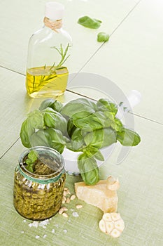 Basil pesto with ingredients.