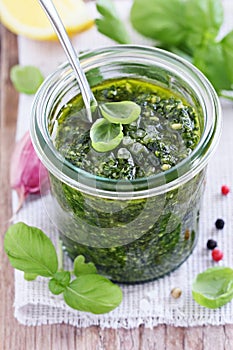 Basil pesto on a rustic wooden table
