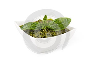 Basil pesto in a small bowl