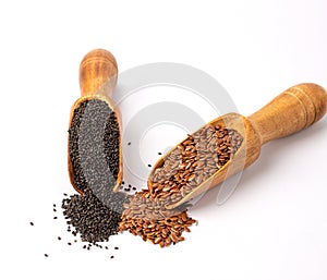 Basil seeds and Flaxseed on wooden spoons