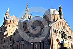 Basilica del Santo in Padua. Illuminated by the sun near the sunset with the spiers, the central one with an angel, the bell tower