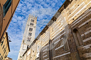 Basilica di San Frediano in Lucca, Italy. Old cozy street in Lucca, Italy. Lucca is a city and comune in Tuscany. It is the