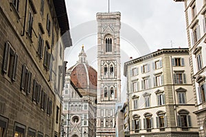 Basilica di Santa Maria del Fiore with Giotto campanile tower bell and Baptistery of San Giovanni. View from street of Florence, photo