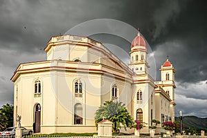 Basilica in honour of Our Lady of Charity with black thunder clouds above, El Cobre, Santiago de Cuba, Cuba