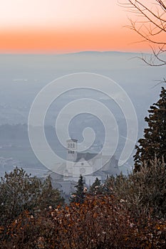 Basilica of Saint Francis of Assisi from hills at sunset
