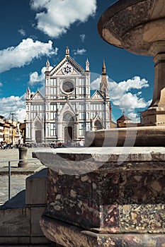 The Basilica of Santa Croce and the fountain in Santa Croce Square in Florence, Italy