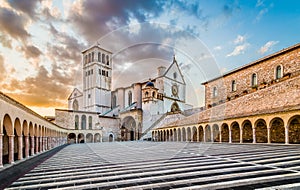 Basilica of St. Francis of Assisi at sunset in Assisi, Umbria, Italy photo