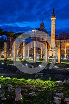 The Basilica Ulpia and the Trajan`s Column at night in Rome, Italy.