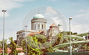 Basilica and water slide in the thermal spa and baths in Esztergom, yellow photo filter