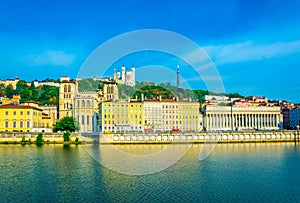 Basilique Notre Dame de Fourviï¿½re and cathedral saint jean Baptiste viewed behind river Saone in Lyon, France