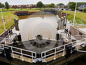 Basin and gates of new lock in Termunterzijldiep in village of Termunterzijl, Eemsdelta, Groningen, Netherlands photo