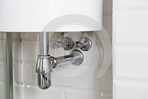 Basin siphon or sink drain in a bathroom, clean