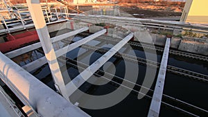 Basins with water at wastewater treatment station at sunset