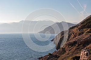 Baska - Coastal hiking trail along steep cliffs and mountains near tourist town Baska, Krk island, Primorje-Gorski Kotar