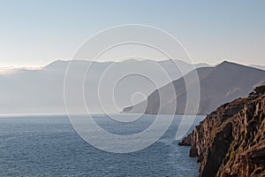 Baska - Coastal hiking trail along steep cliffs and mountains near tourist town Baska, Krk island, Primorje-Gorski Kotar