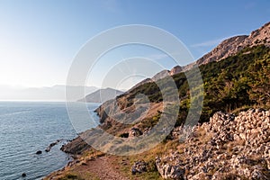 Baska - Coastal hiking trail along steep cliffs and mountains near tourist town Baska, Krk island, Primorje-Gorski Kotar