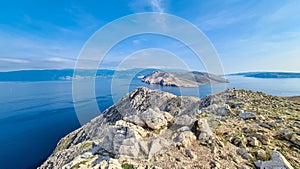 Baska - Panoramic view of deserted island Prvic seen from idyllic hiking trail near coastal town Baska, Krk Otok