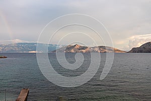 Baska - Scenic view of deserted island Prvic seen from beach in coastal town Baska, Krk Otok, Primorje-Gorski Kota