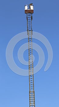 Basket with aerial platform over the very long special ladder