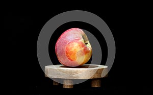 a basket of apples on a black background with a black background behind it and a black background behind it