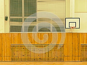 Basket ball hoop on the wall. The school sporting hall
