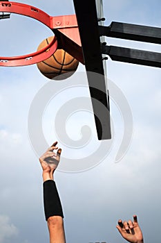 Basket Ball Player hands jumping in street basket playground