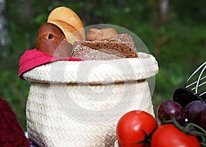 A basket with bread at a picnic