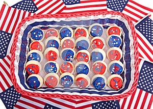 Basket of bright patriotic cookies with american flags under