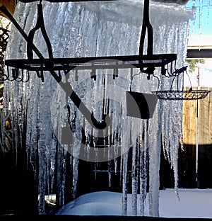Icicle curtain behind hanging garden tools