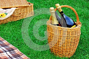 Basket With Champagne Wine, Picnic Hamper And Blanket