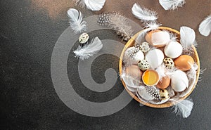 basket of chicken eggs on a dark background. top view