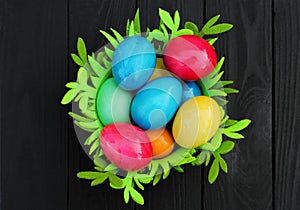 Basket with colored easter eggs. Easter holiday