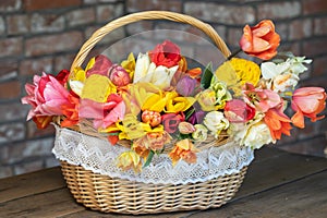 Basket with colorful bouquets of tulips