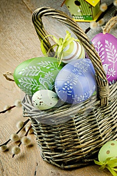 Basket with colorful Easter eggs